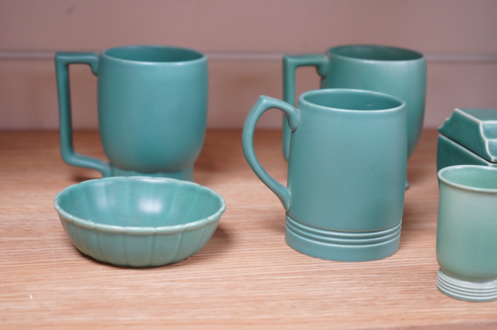 Keith Murray for Wedgwood, three green mugs, cigarette box, fluted dish and small vase, largest 12cm high (6)